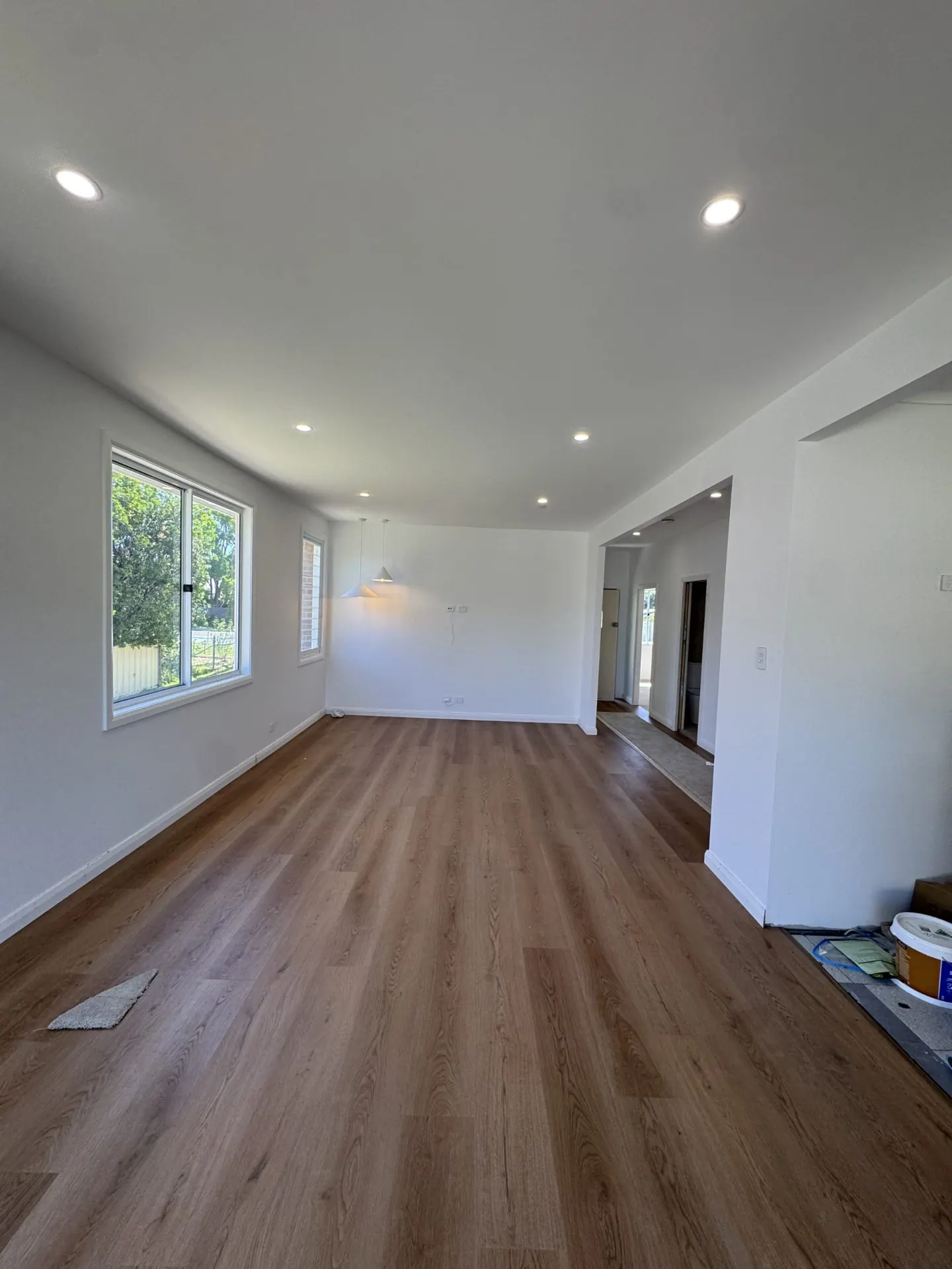 Freshly installed LED downlights and pendant lights in a Newcastle living room