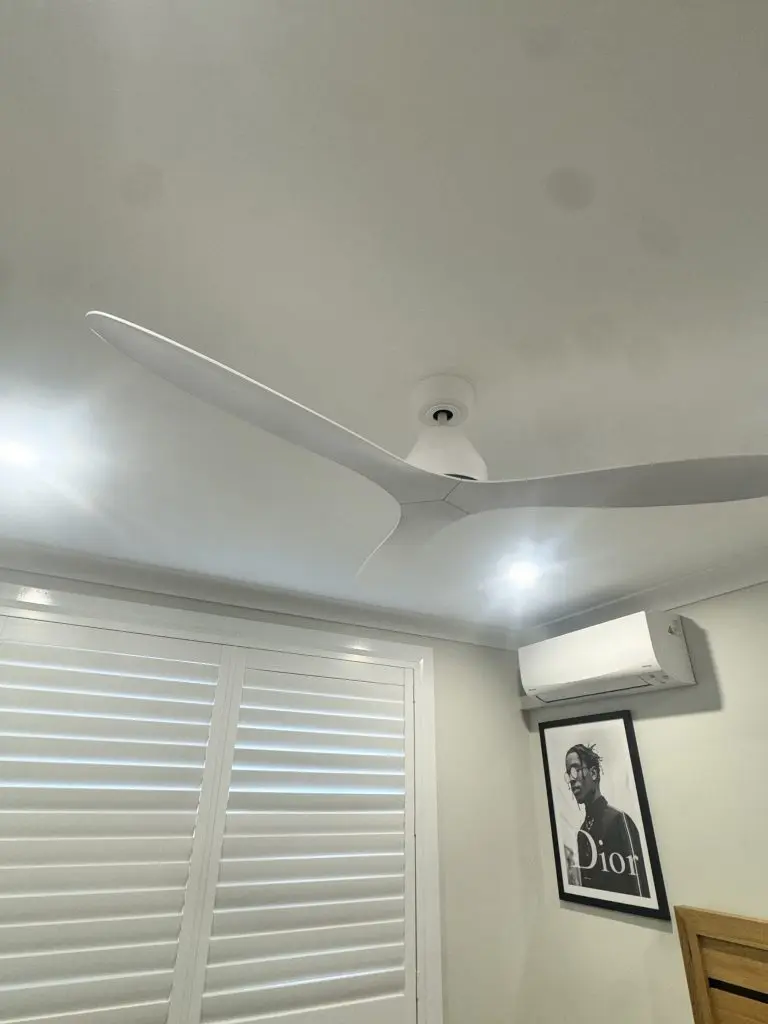 White three-blade ceiling fan installed in a Newcastle bedroom